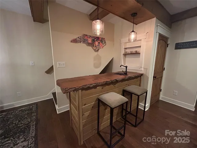 a kitchen with a table and chairs