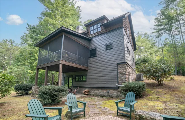 a view of house with yard outdoor seating and green space