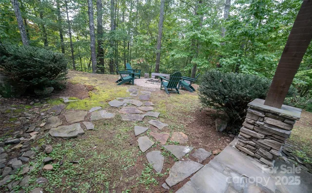 a view of a backyard with sitting area