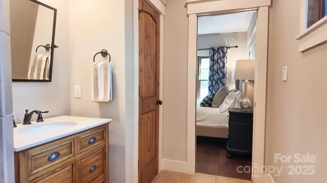 a en suite bathroom with a sink and a mirror