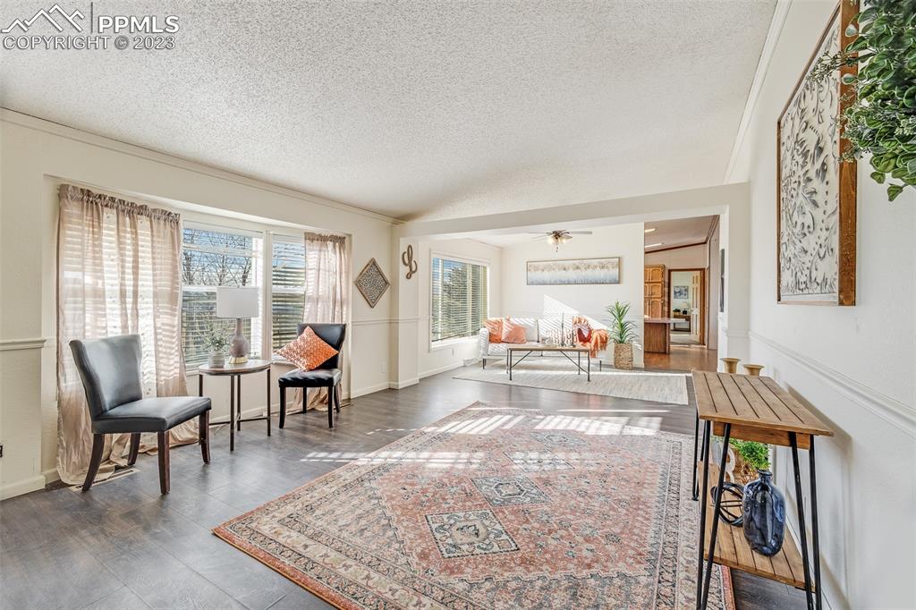 29550 Paint Mine Road Calhan, CO 80808 - Photo 15 of 33 a living room with furniture and a wooden floor