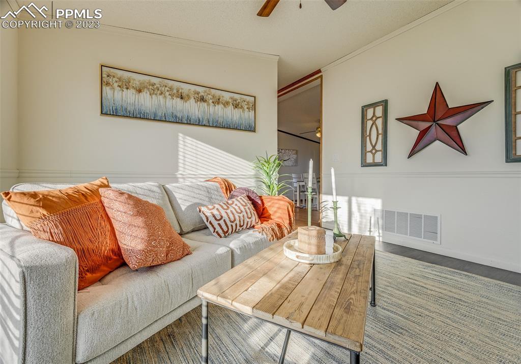 29550 Paint Mine Road Calhan, CO 80808 - Photo 19 of 33 a living room with furniture and wooden floor