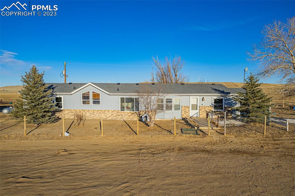 29550 Paint Mine Road Calhan, CO 80808 - Photo 32 of 33 a view of a house with a patio