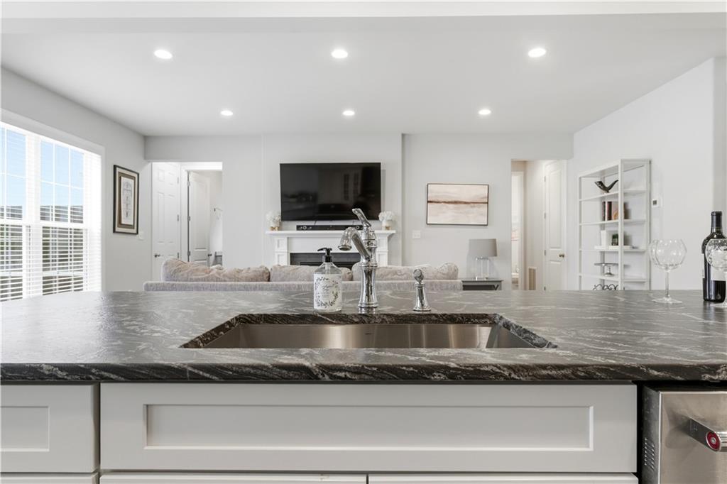 1502 Orion Road Bridgeville, PA 15017 - Photo 13 of 46 a kitchen with granite countertop a sink and a counter top space