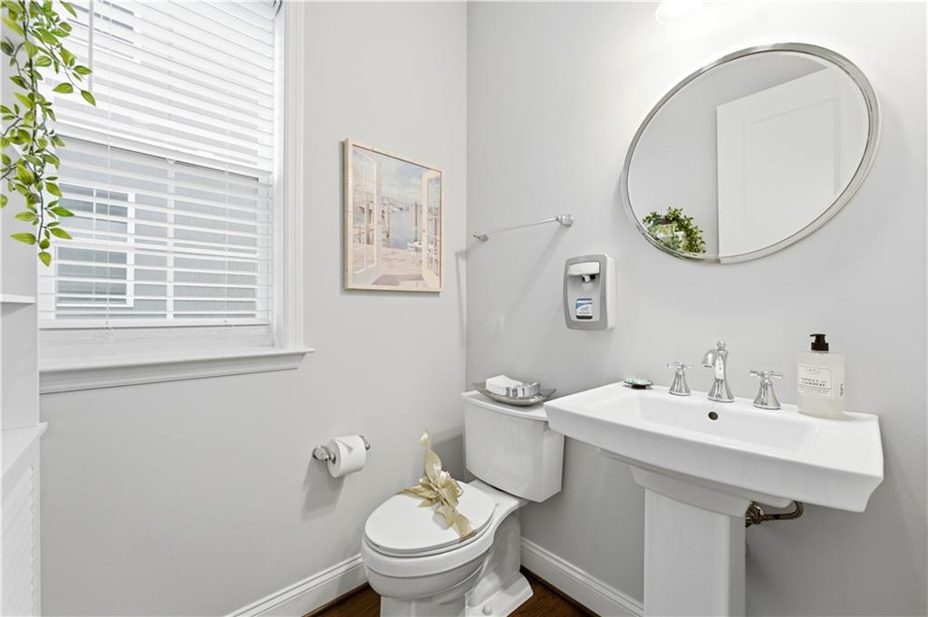 1502 Orion Road Bridgeville, PA 15017 - Photo 17 of 46 a bathroom with a sink and a mirror