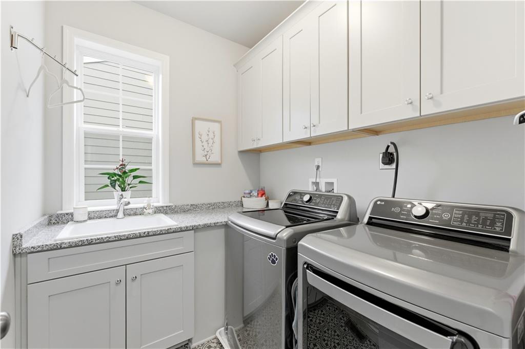 1502 Orion Road Bridgeville, PA 15017 - Photo 18 of 46 a kitchen with a sink stove and cabinets