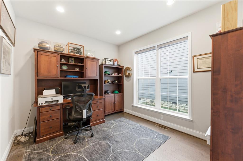 1502 Orion Road Bridgeville, PA 15017 - Photo 19 of 46 a view of a workspace with furniture and a window