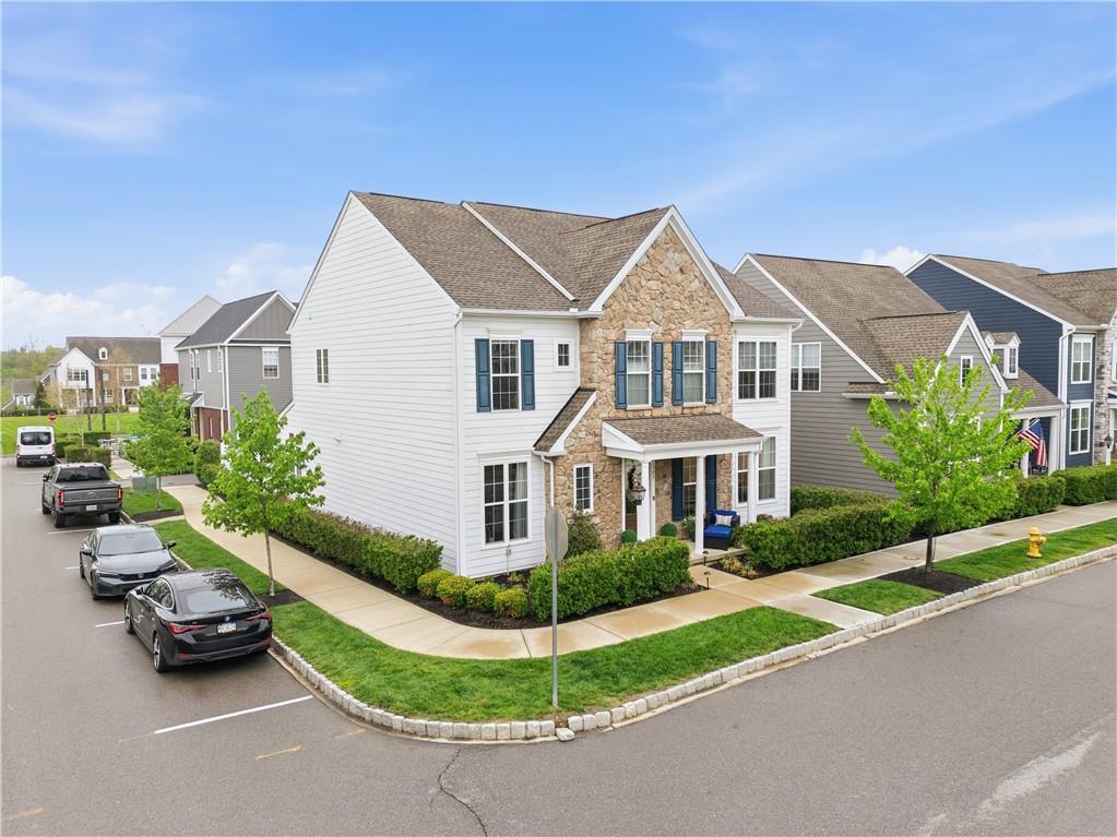 1502 Orion Road Bridgeville, PA 15017 - Photo 2 of 46 a view of a white house next to a yard with potted plants
