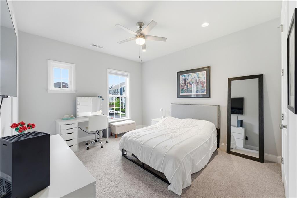 1502 Orion Road Bridgeville, PA 15017 - Photo 22 of 46 a bedroom with a bed and a chandelier