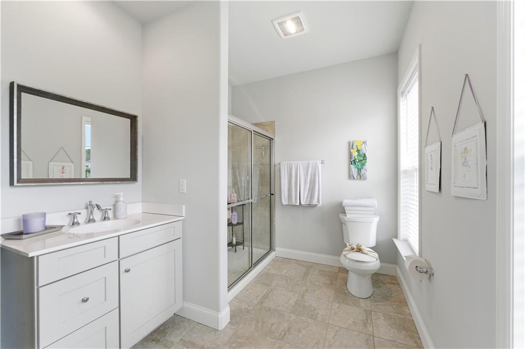 1502 Orion Road Bridgeville, PA 15017 - Photo 24 of 46 a bathroom with a toilet sink and double vanity