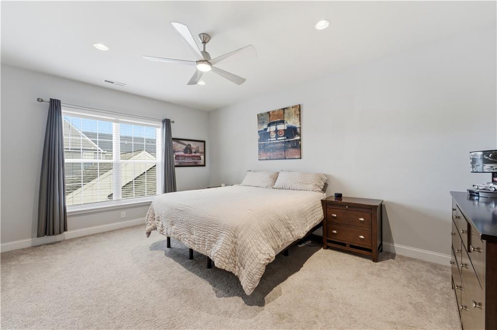 1502 Orion Road Bridgeville, PA 15017 - Photo 25 of 46 a spacious bedroom with a large bed and a large window