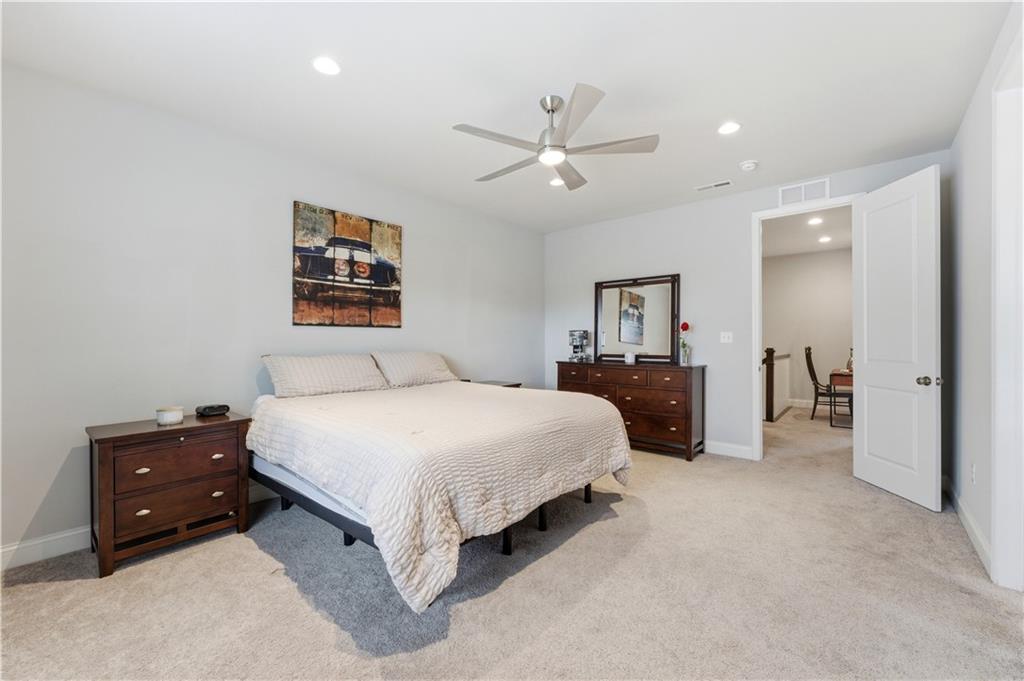 1502 Orion Road Bridgeville, PA 15017 - Photo 26 of 46 a spacious bedroom with a bed and a ceiling fan