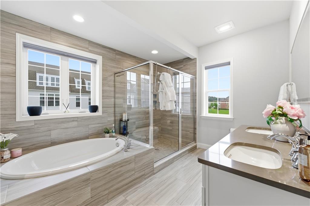 1502 Orion Road Bridgeville, PA 15017 - Photo 27 of 46 a bathroom with a granite countertop tub sink and mirror