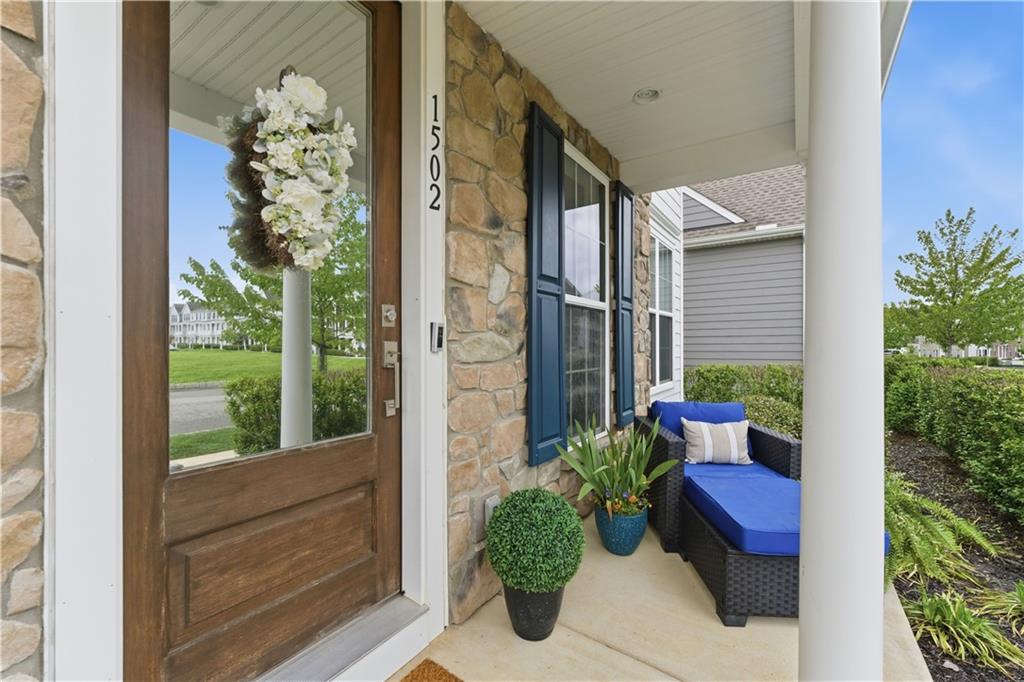 1502 Orion Road Bridgeville, PA 15017 - Photo 3 of 46 a view of a porch with chairs and potted plants