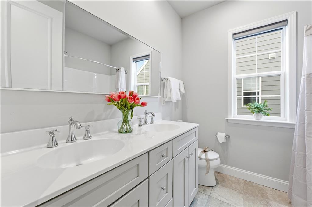 1502 Orion Road Bridgeville, PA 15017 - Photo 32 of 46 a bathroom with a sink a vanity and a toilet