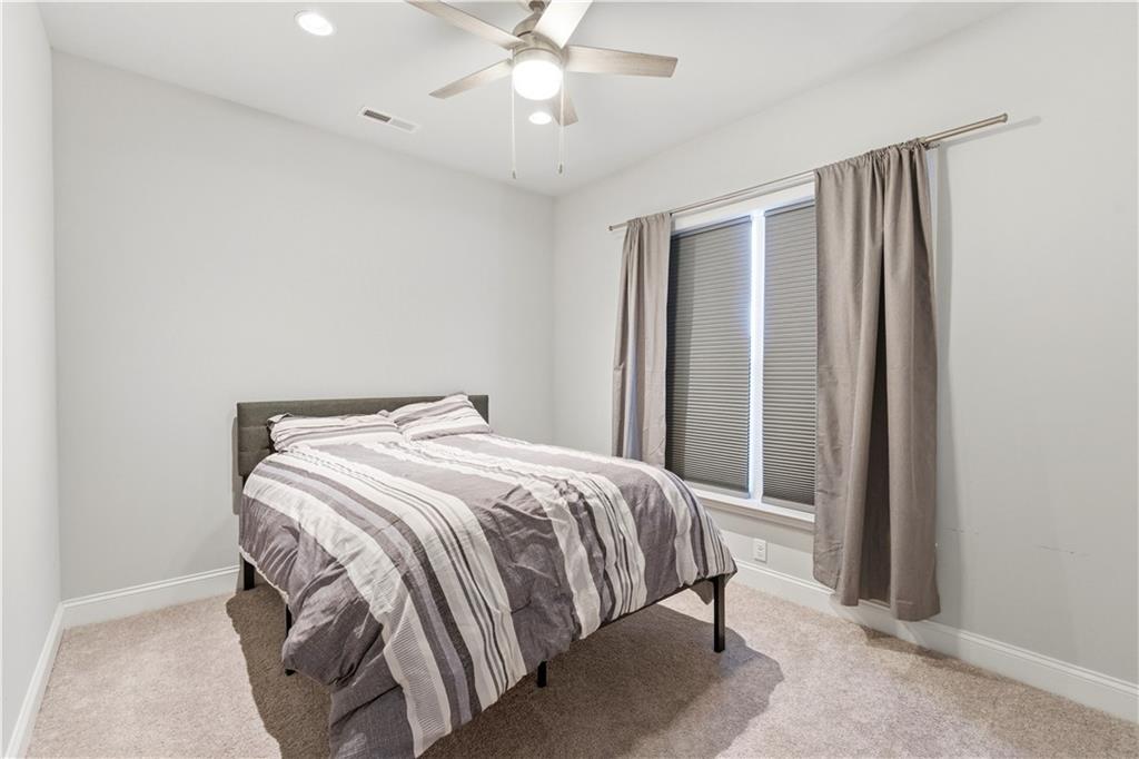 1502 Orion Road Bridgeville, PA 15017 - Photo 33 of 46 a bedroom with a bed and a chandelier