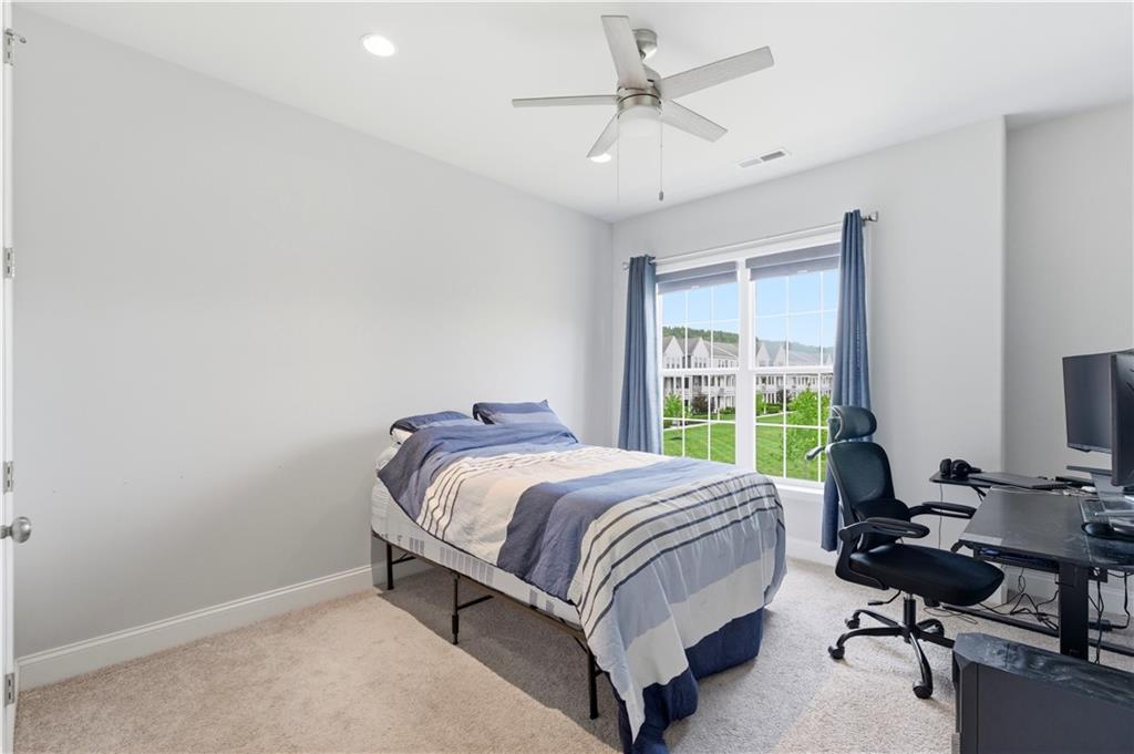 1502 Orion Road Bridgeville, PA 15017 - Photo 34 of 46 a bed sitting in a bedroom next to a window