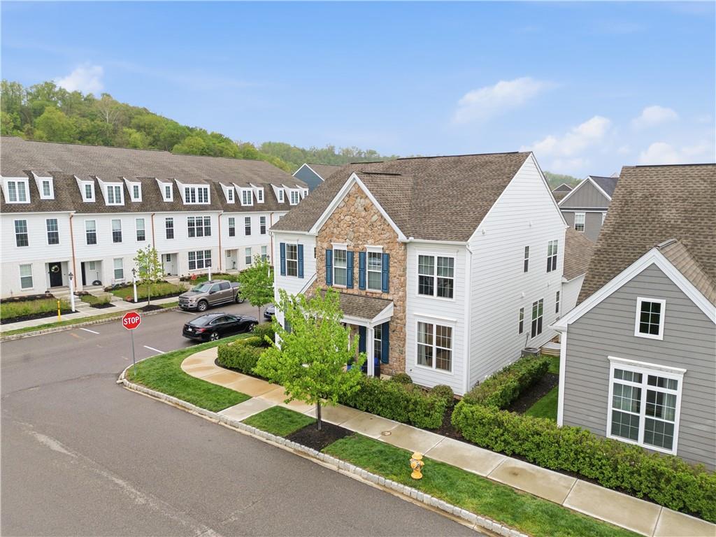 1502 Orion Road Bridgeville, PA 15017 - Photo 42 of 46 a view of a white house with a large windows next to a yard