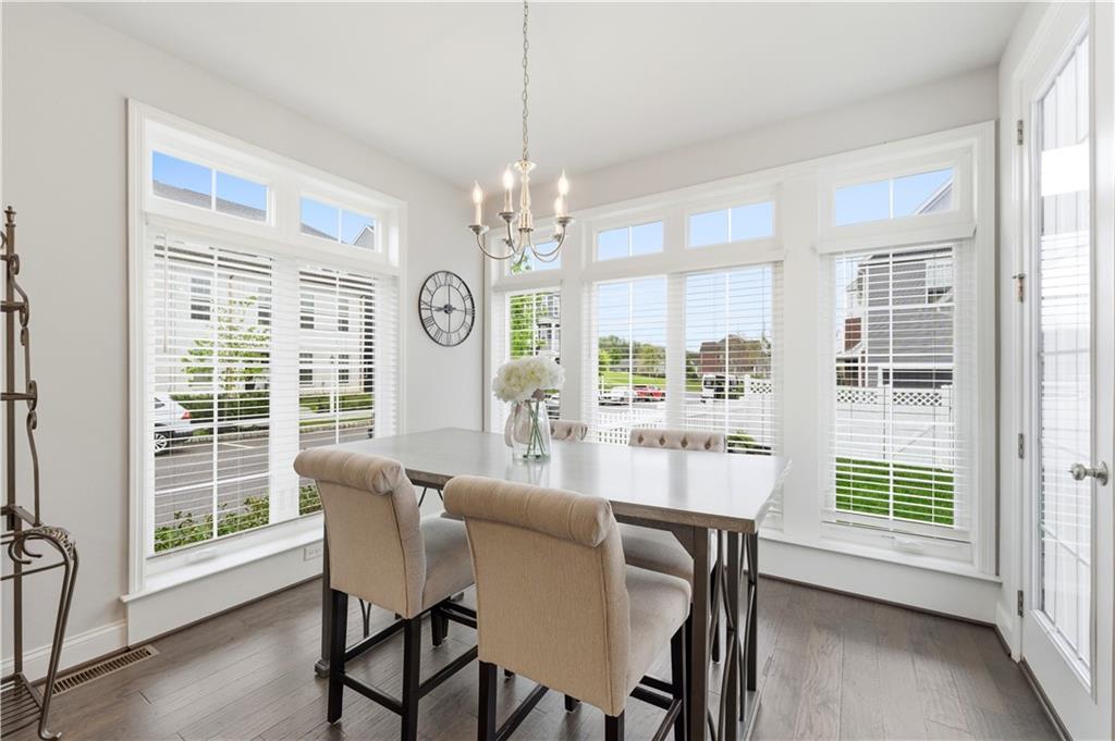 1502 Orion Road Bridgeville, PA 15017 - Photo 7 of 46 a dining room with furniture large windows and wooden floor