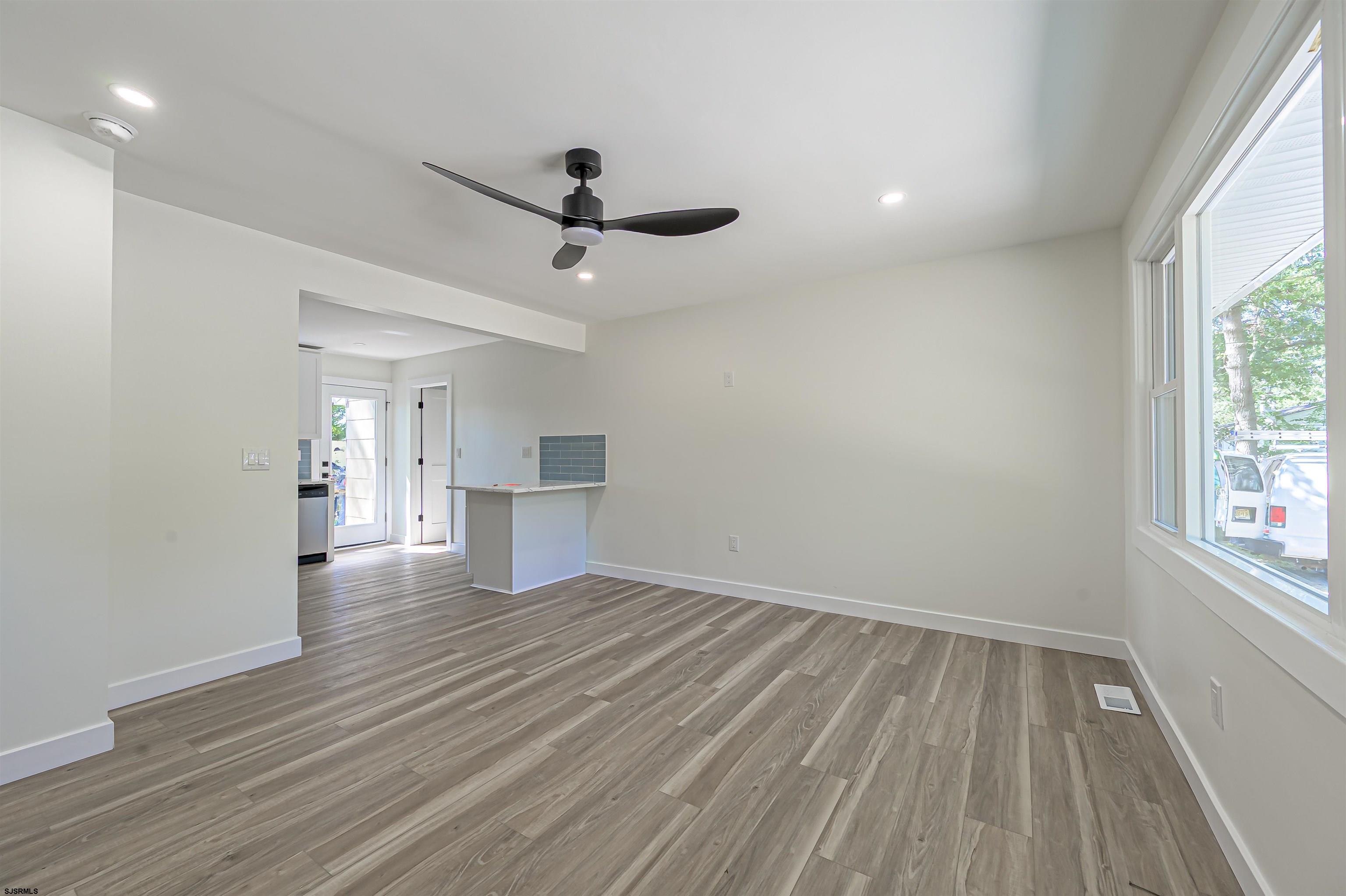 310 Sandy Lane Galloway Township, NJ 08205 - Photo 13 of 48 wooden floor in an empty room with a window