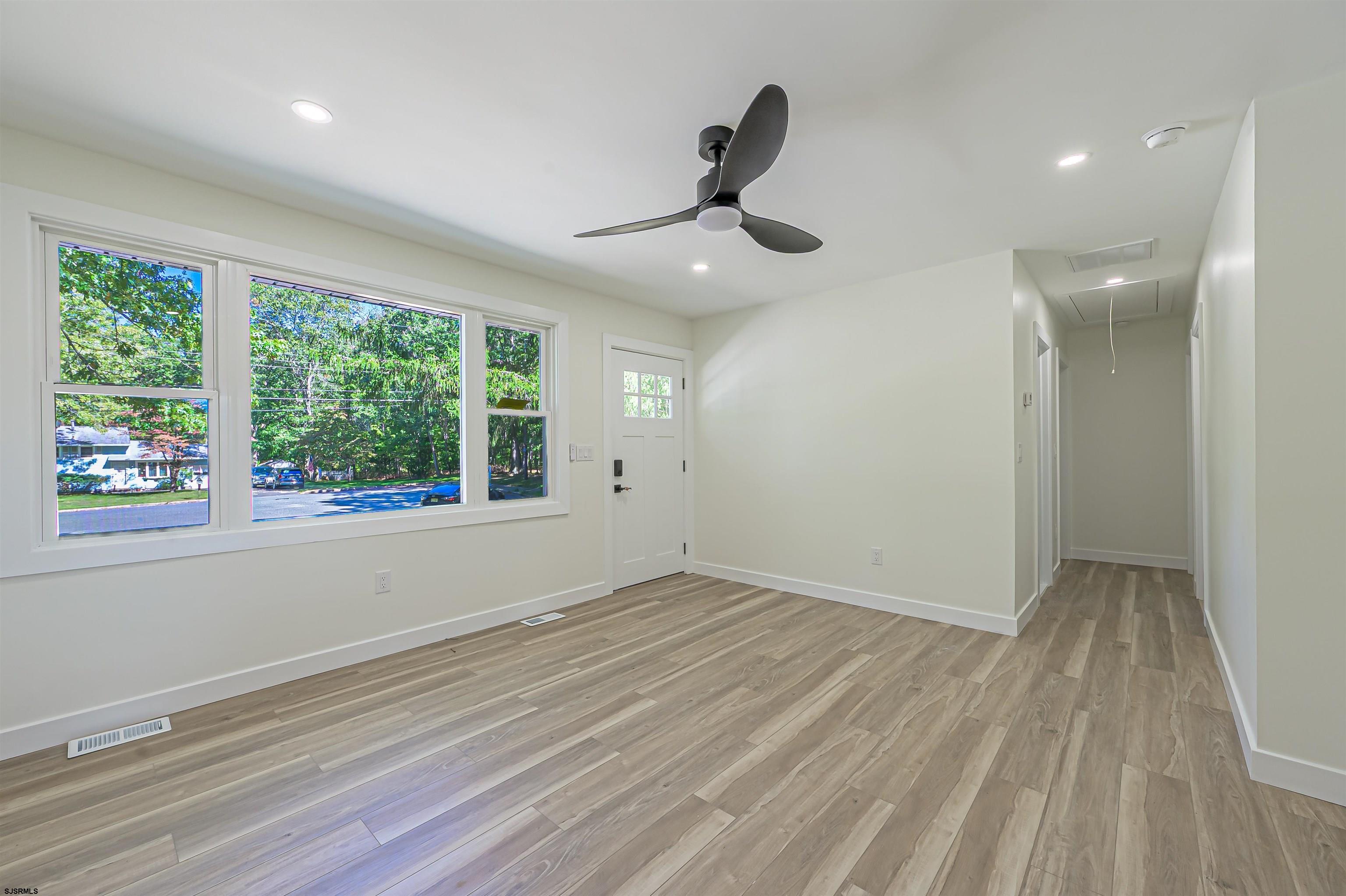 310 Sandy Lane Galloway Township, NJ 08205 - Photo 15 of 48 wooden floor in an empty room with a window