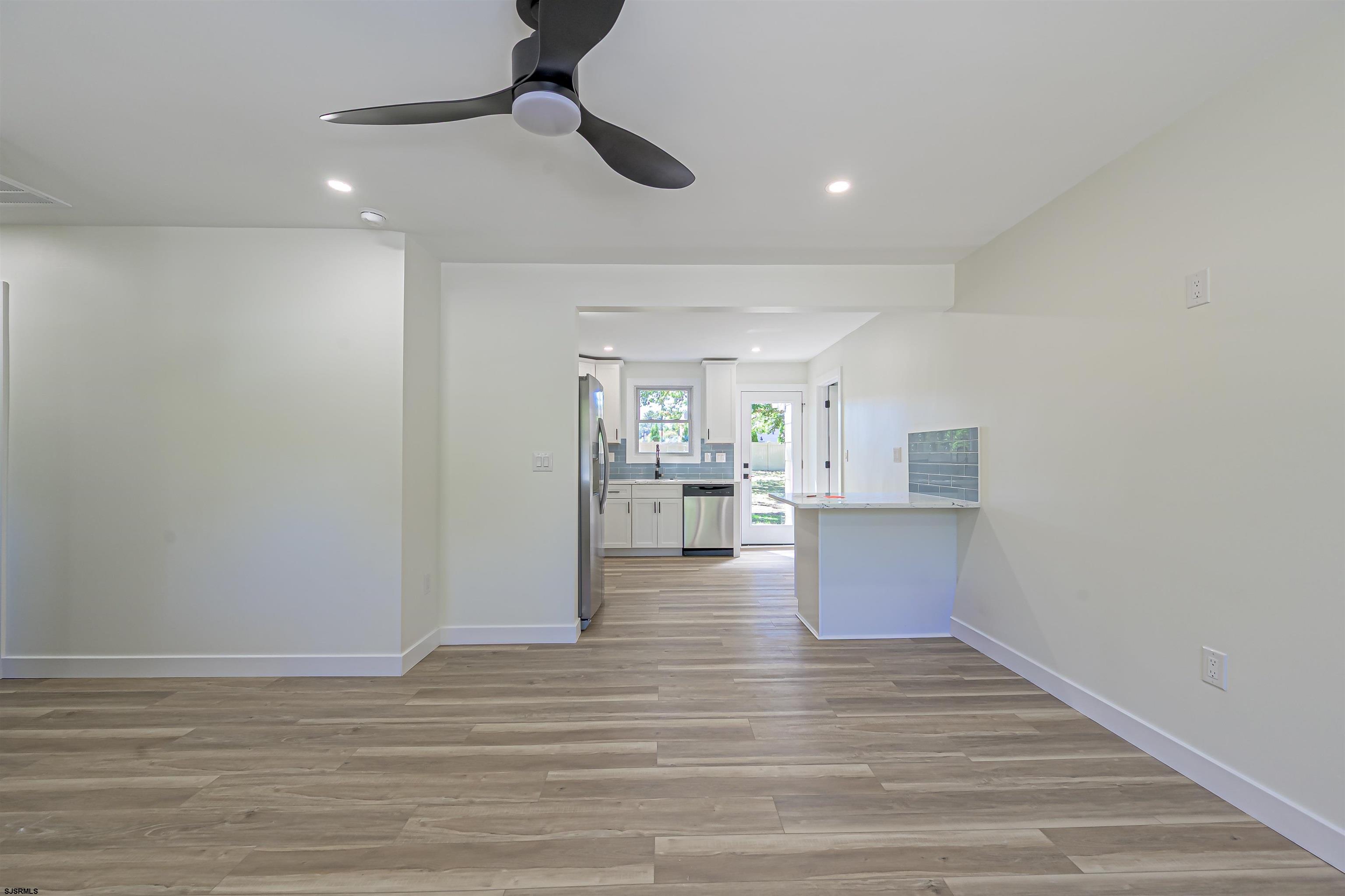 310 Sandy Lane Galloway Township, NJ 08205 - Photo 17 of 48 a view of kitchen and hall with wooden floor