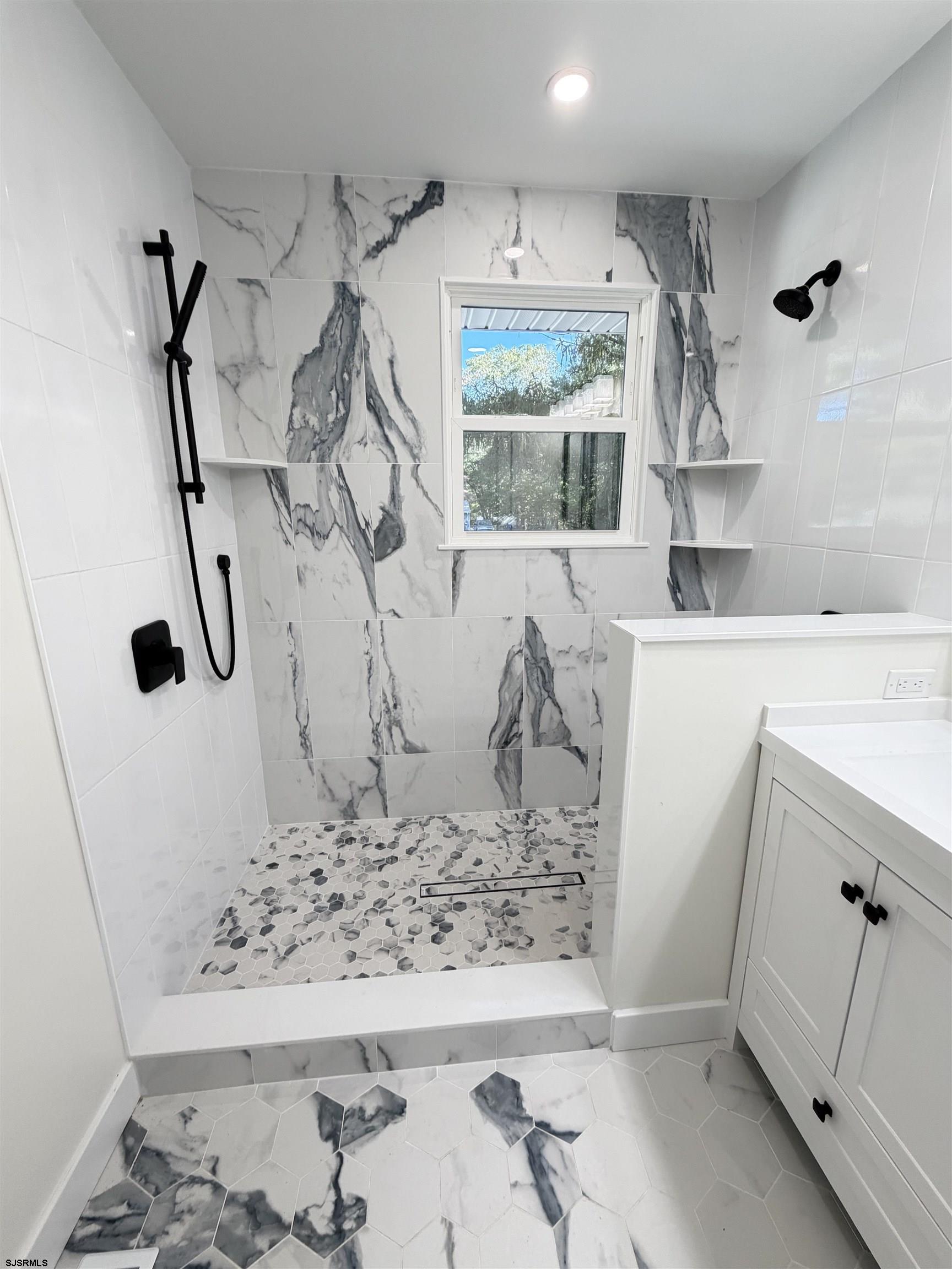 310 Sandy Lane Galloway Township, NJ 08205 - Photo 25 of 48 a bathroom with a bathtub and a shower