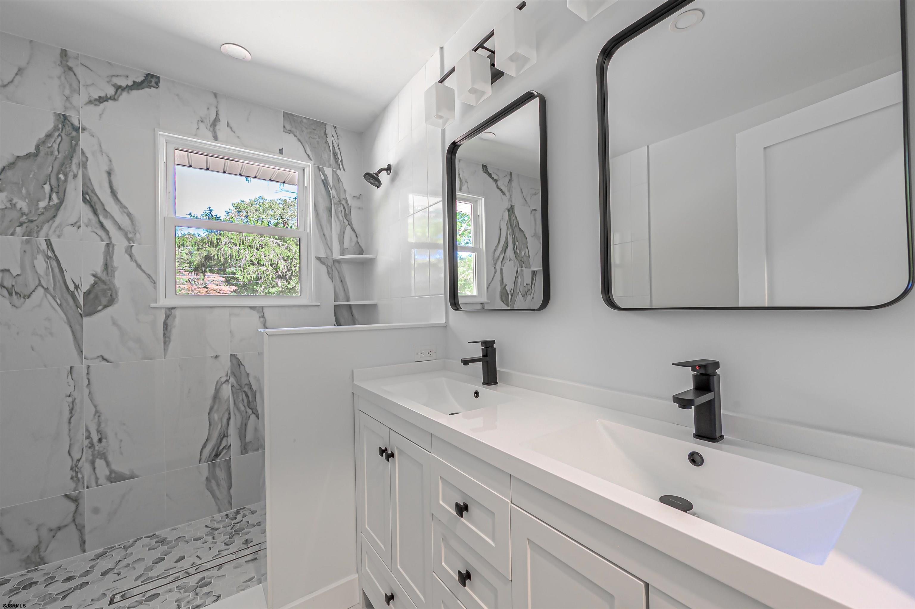 310 Sandy Lane Galloway Township, NJ 08205 - Photo 27 of 48 a bathroom with a sink and a mirror