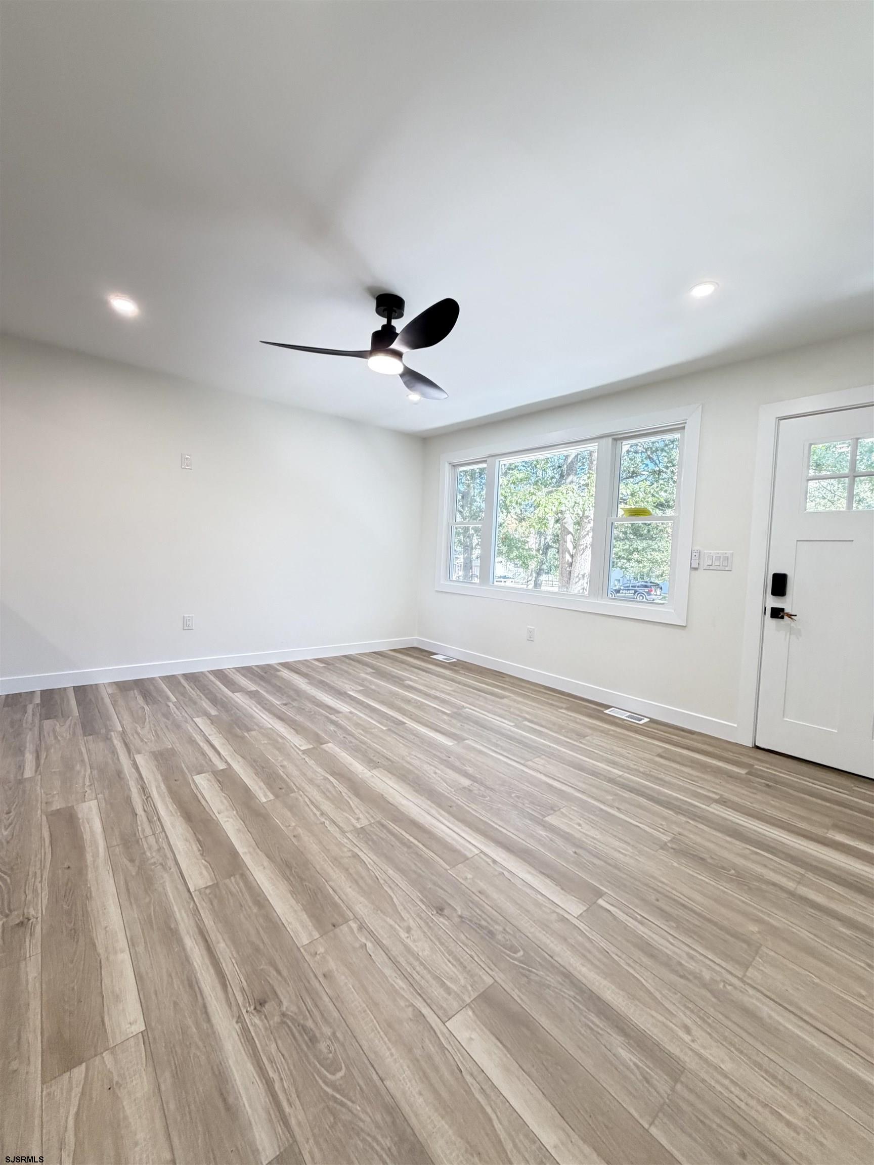 310 Sandy Lane Galloway Township, NJ 08205 - Photo 41 of 48 a view of empty room with wooden floor and fan