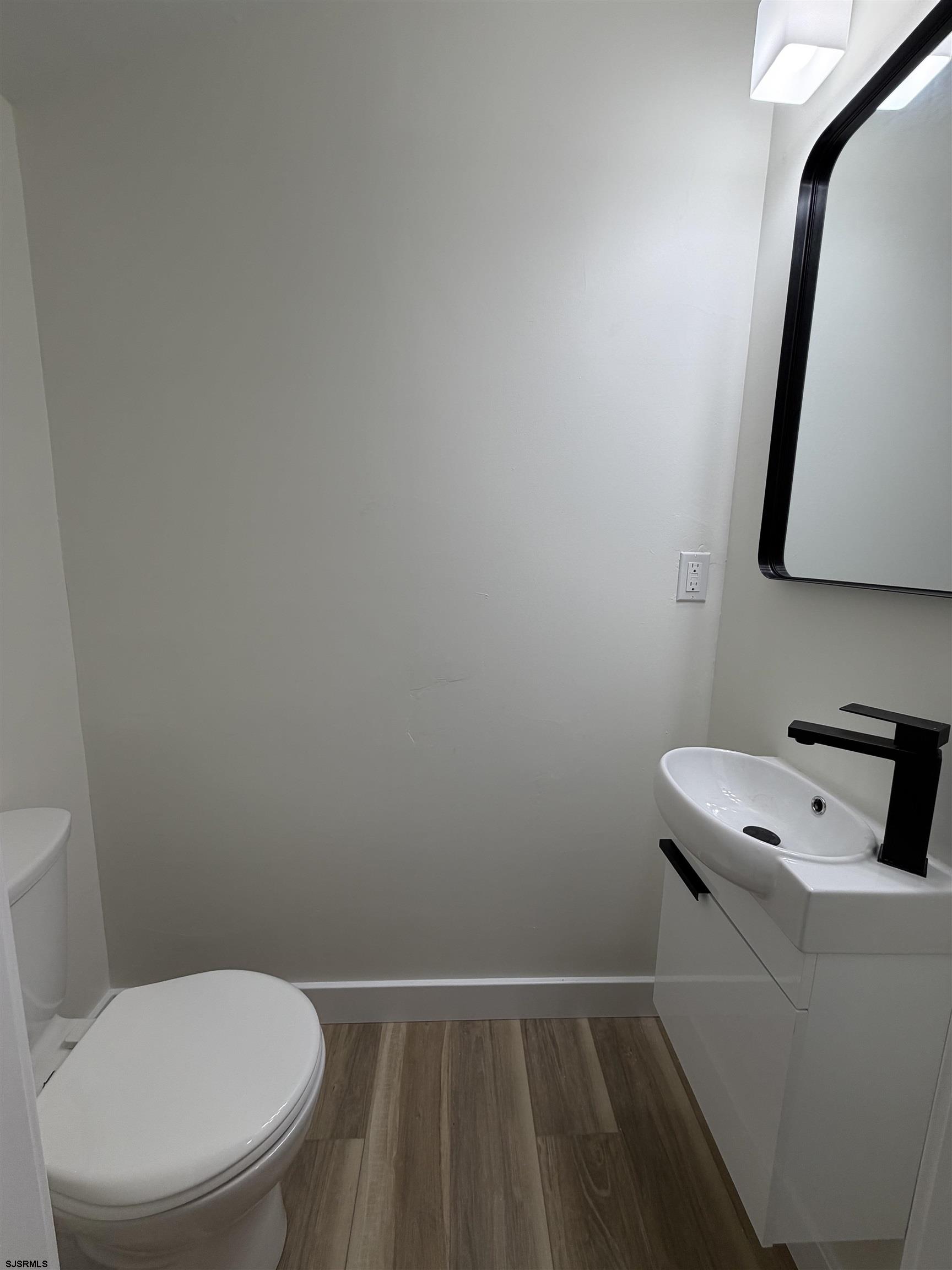 310 Sandy Lane Galloway Township, NJ 08205 - Photo 42 of 48 a white toilet sitting next to a white sink