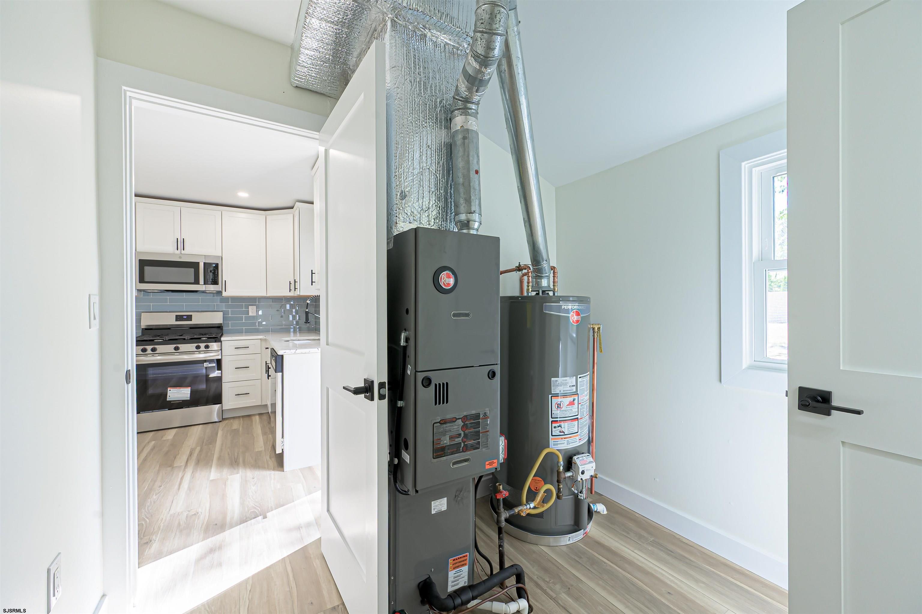 310 Sandy Lane Galloway Township, NJ 08205 - Photo 46 of 48 a room with stainless steel appliances kitchen island granite countertop a refrigerator and a stove