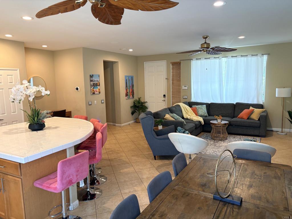 80596 Key Largo Avenue Indio, CA 92201 - Photo 9 of 59 a living room with furniture a chandelier and a wooden floor