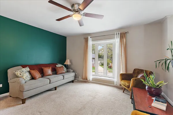 a living room with furniture and a window
