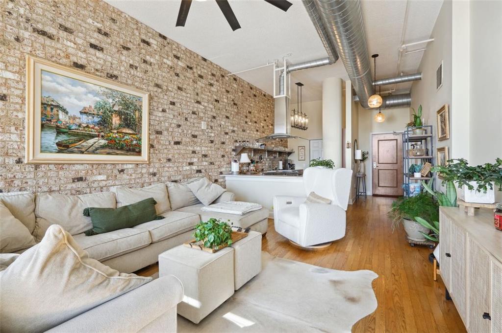 a living room with furniture and flowers