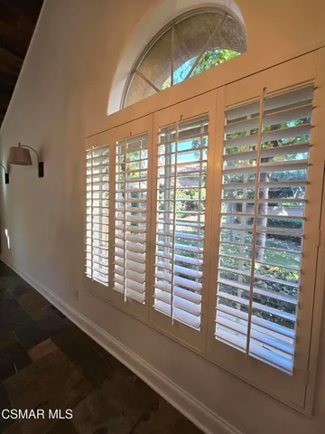 a view of a room that has a large window