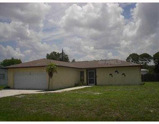 923 Leeward Road Venice, FL 34293 - Photo 1 of 1 a view of a backyard with potted plants and a yard