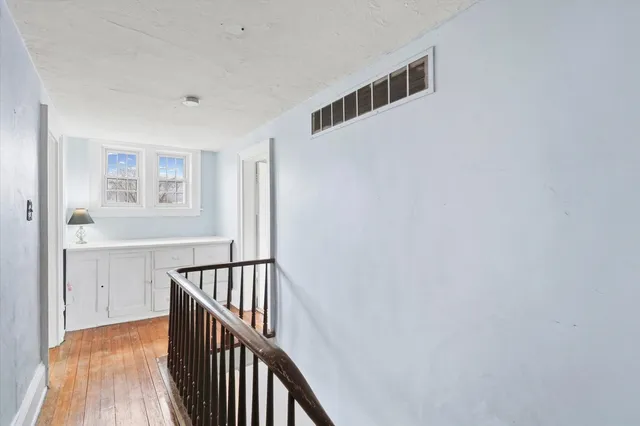 a view of entryway with wooden floor