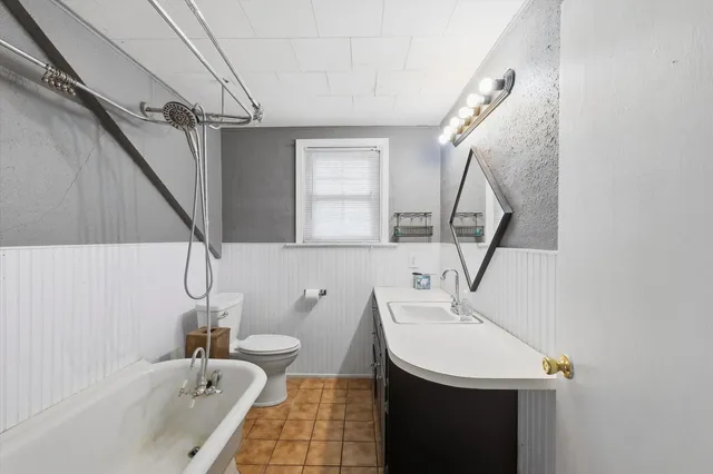 a bathroom with a sink a toilet and a bathtub
