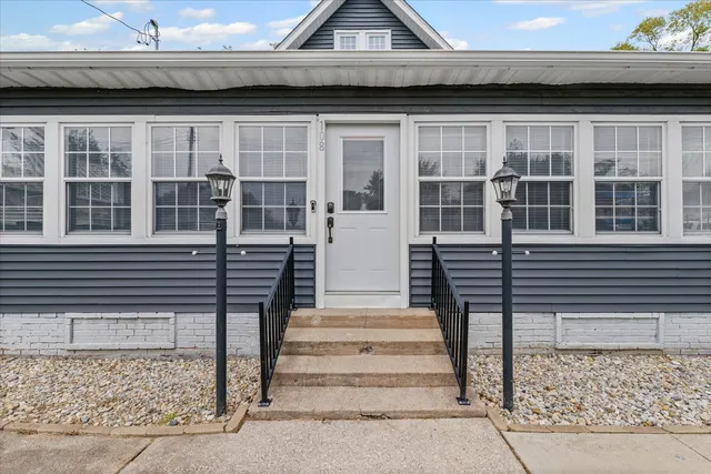 a view of a house with a door and a window