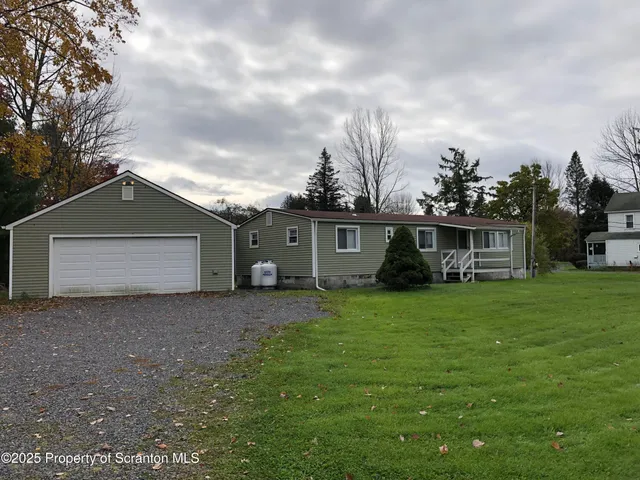 a house view with a garden space