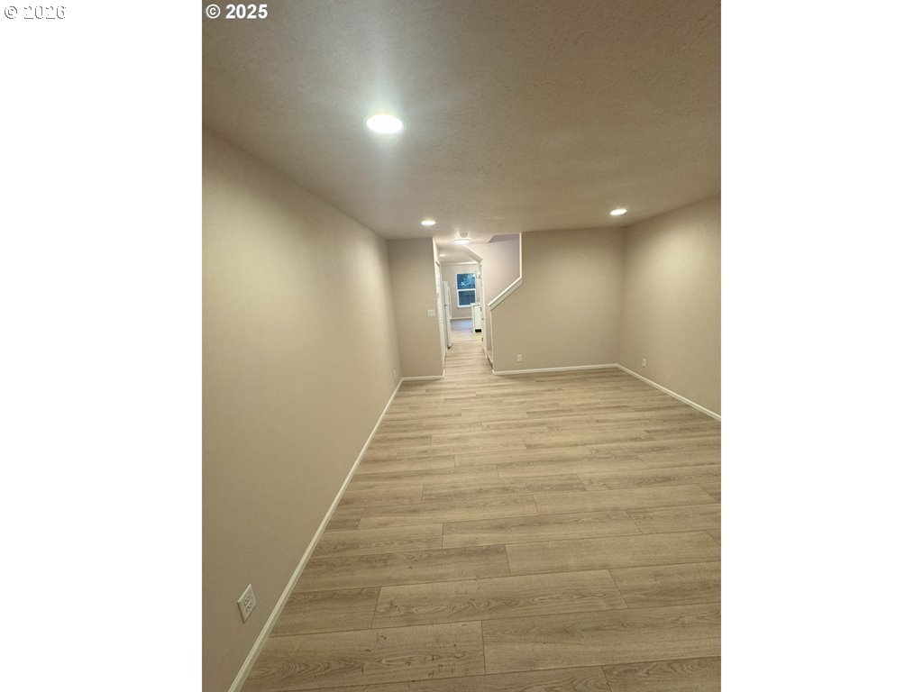 529 Helen Street Eugene, OR 97404 - Photo 5 of 9 a view of a hallway with wooden floor