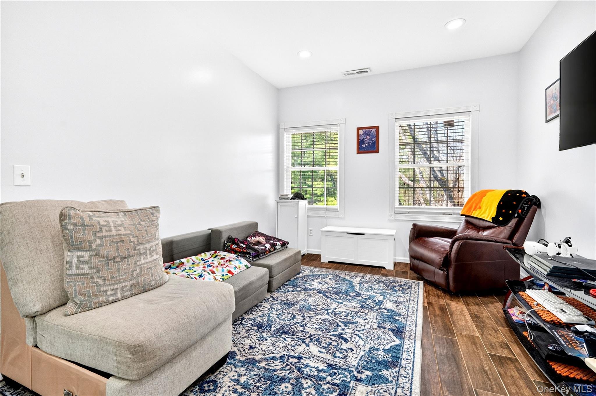 47 Westbrook Road, Unit 47 Newburgh, NY 12550 - Photo 19 of 43 a living room with furniture and a flat screen tv