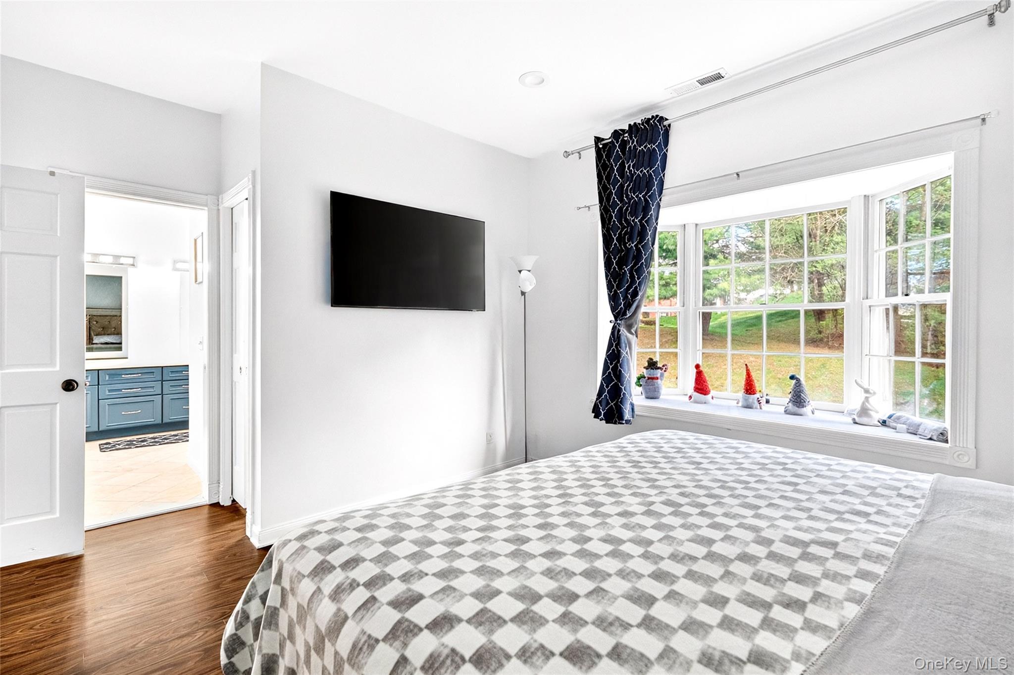 47 Westbrook Road, Unit 47 Newburgh, NY 12550 - Photo 23 of 43 a bedroom with a bed and a flat tv screen next to a window