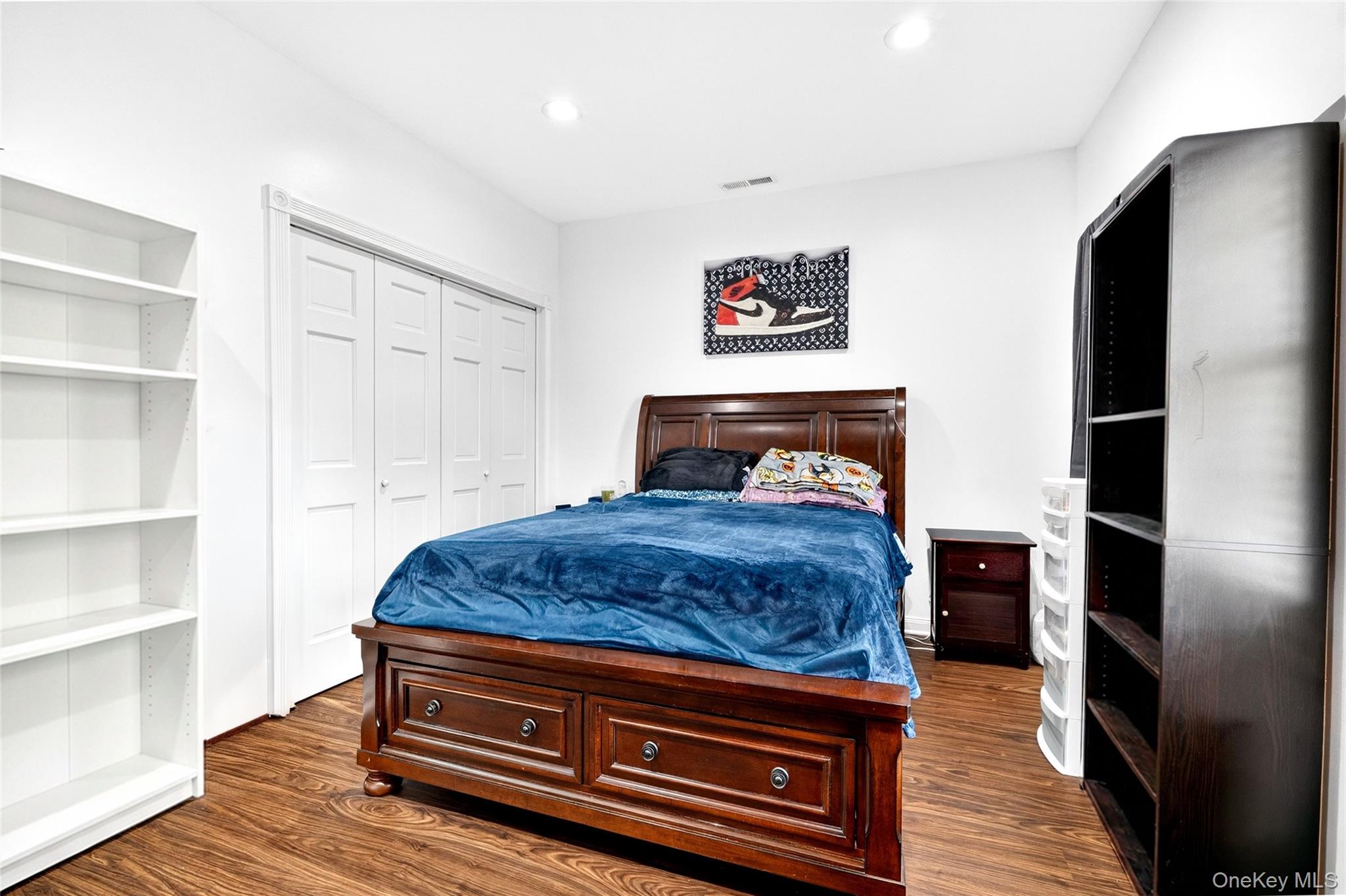 47 Westbrook Road, Unit 47 Newburgh, NY 12550 - Photo 30 of 43 a bedroom with a bed and wooden floor