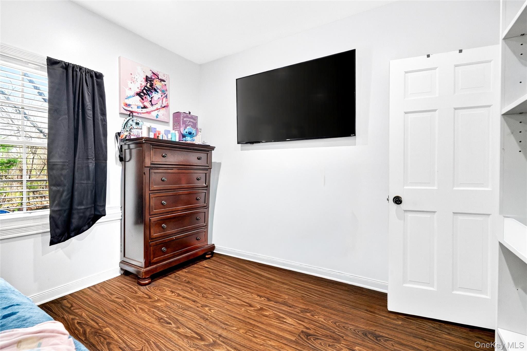 47 Westbrook Road, Unit 47 Newburgh, NY 12550 - Photo 31 of 43 a view of a livingroom with wooden floor and a flat screen tv