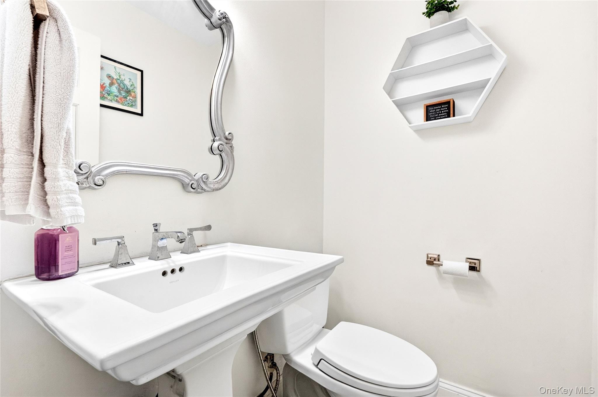 47 Westbrook Road, Unit 47 Newburgh, NY 12550 - Photo 10 of 43 a bathroom with a sink mirror and toilet