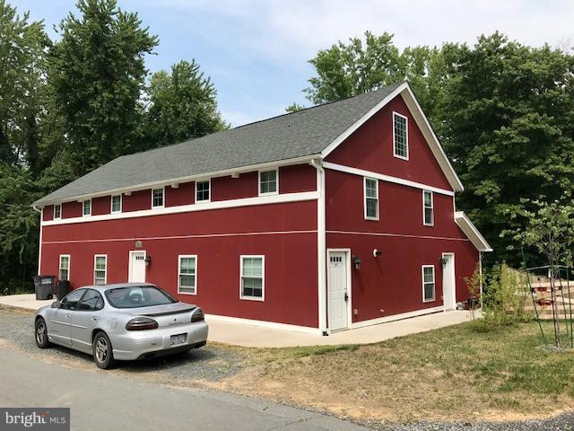 19 North Bridge Street, Unit 201 Round Hill, VA 20141 - Photo 1 of 14 a front view of a house with a yard