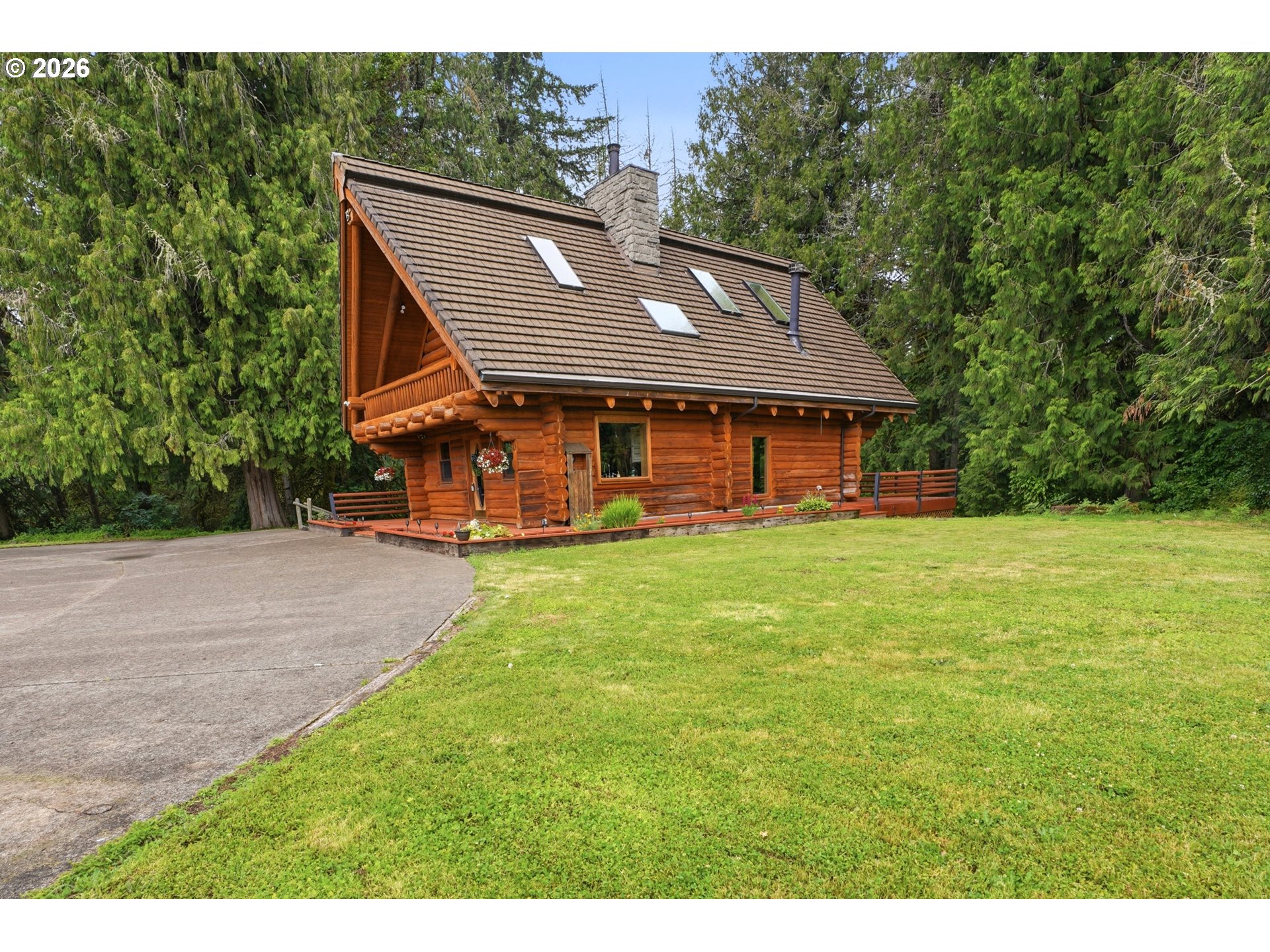 29870 South Dhooghe Road Colton, OR 97017 - Photo 35 of 48 a backyard of a house with wooden fence and large trees