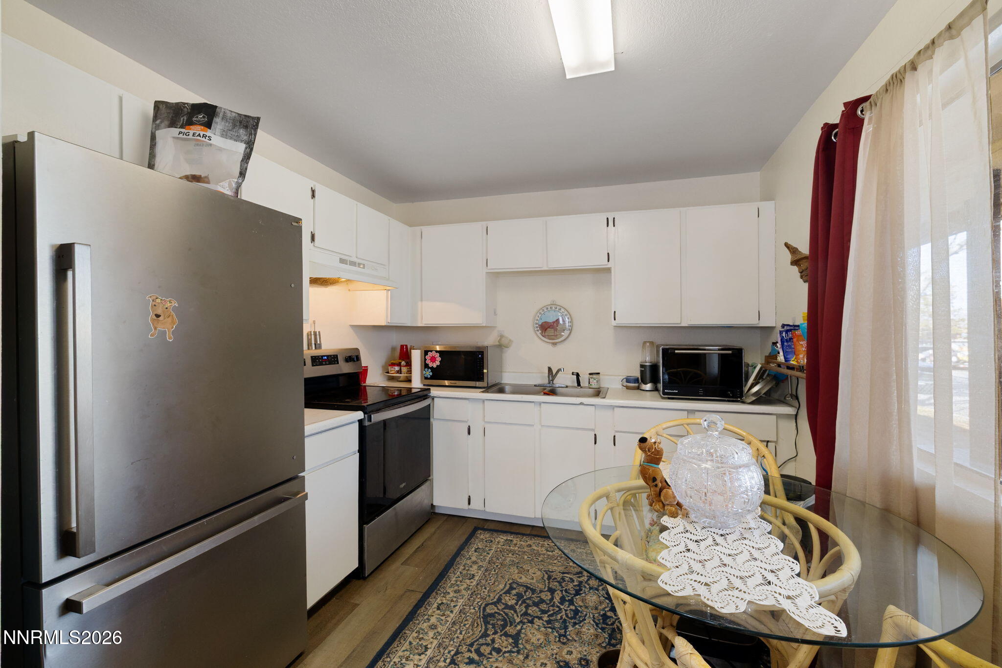 145 K Street Hawthorne, NV 89415 - Photo 11 of 25 a kitchen with stainless steel appliances granite countertop a refrigerator sink and stove