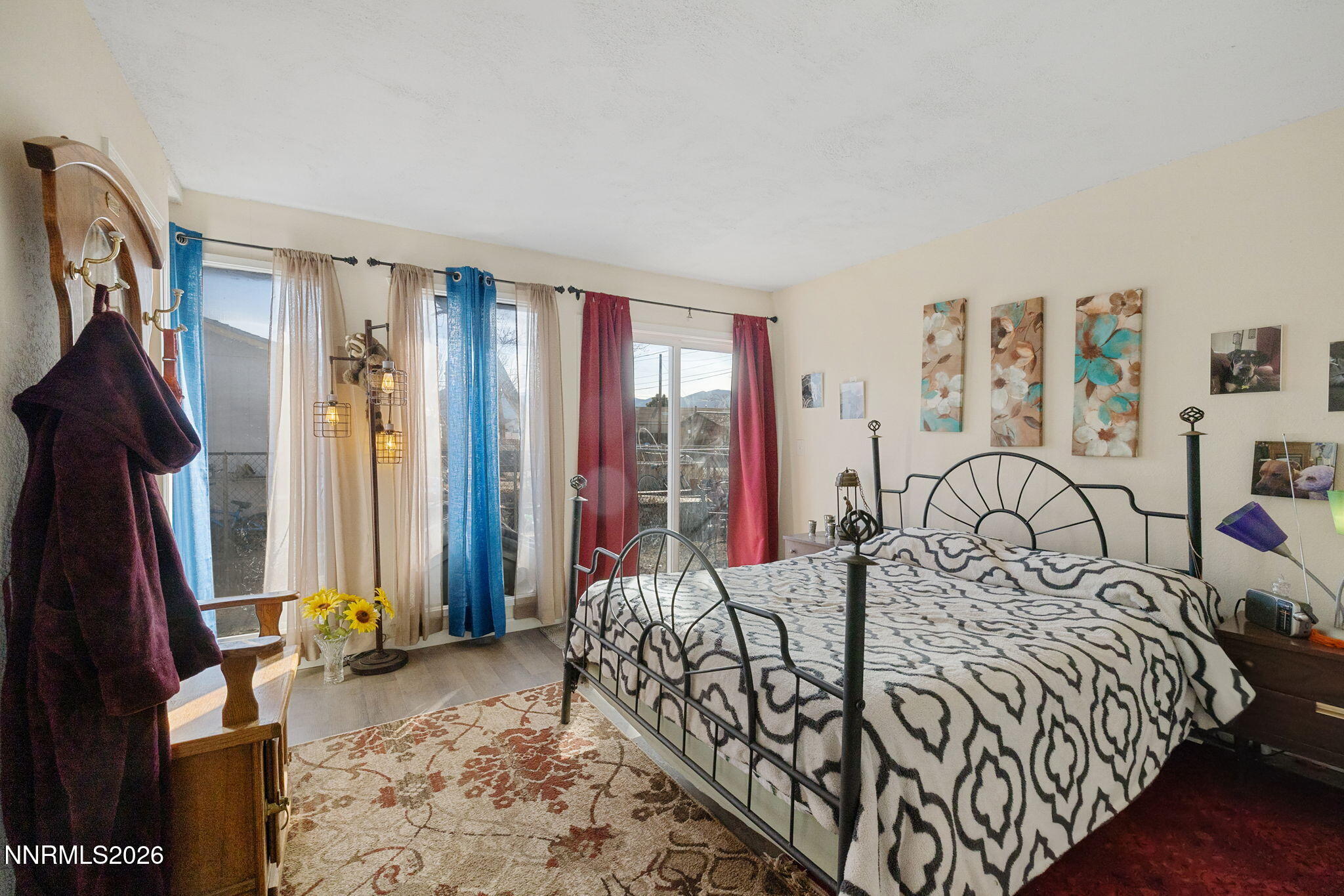 145 K Street Hawthorne, NV 89415 - Photo 13 of 25 a bed sitting in a bedroom next to a window